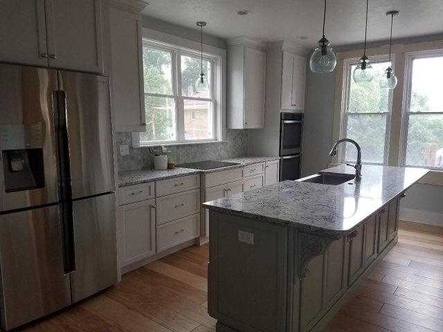 Kitchen converted to a former dining room by Action Builders