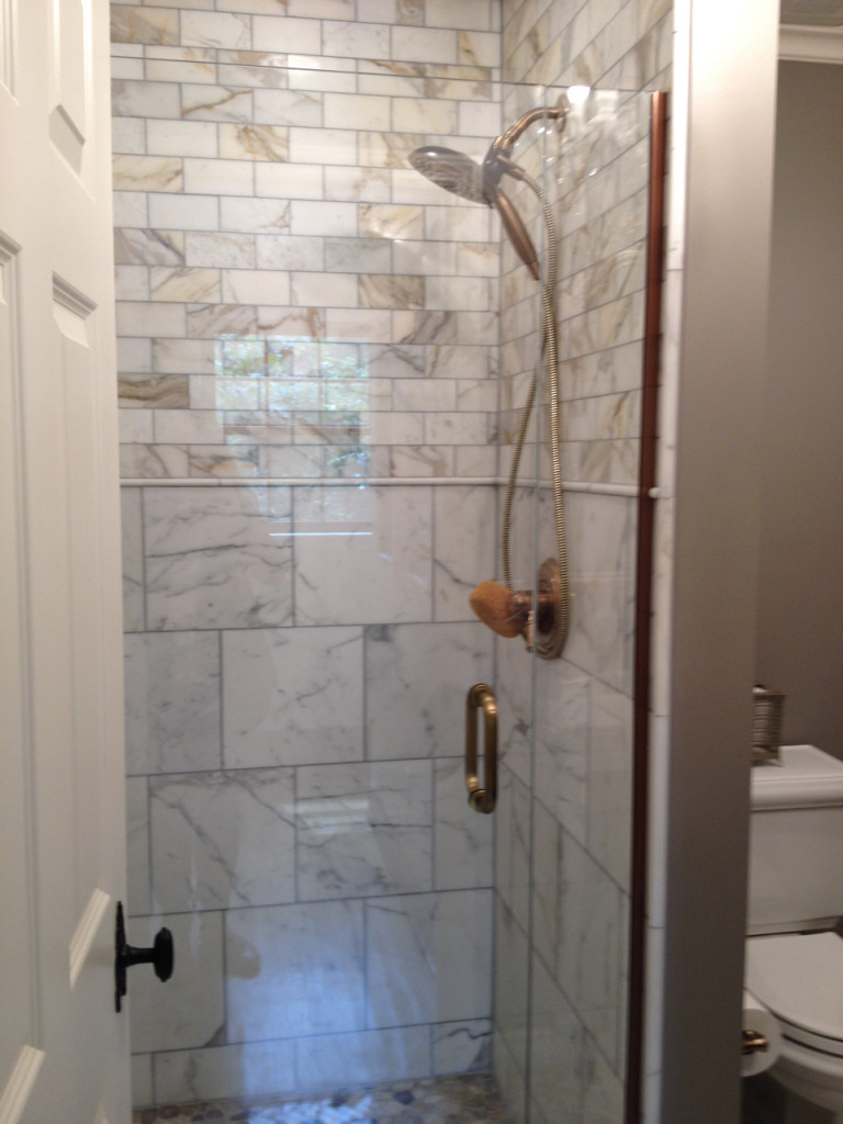 Bathroom addition on a home with brick siding built by Action Builders in Mt. Lebanon